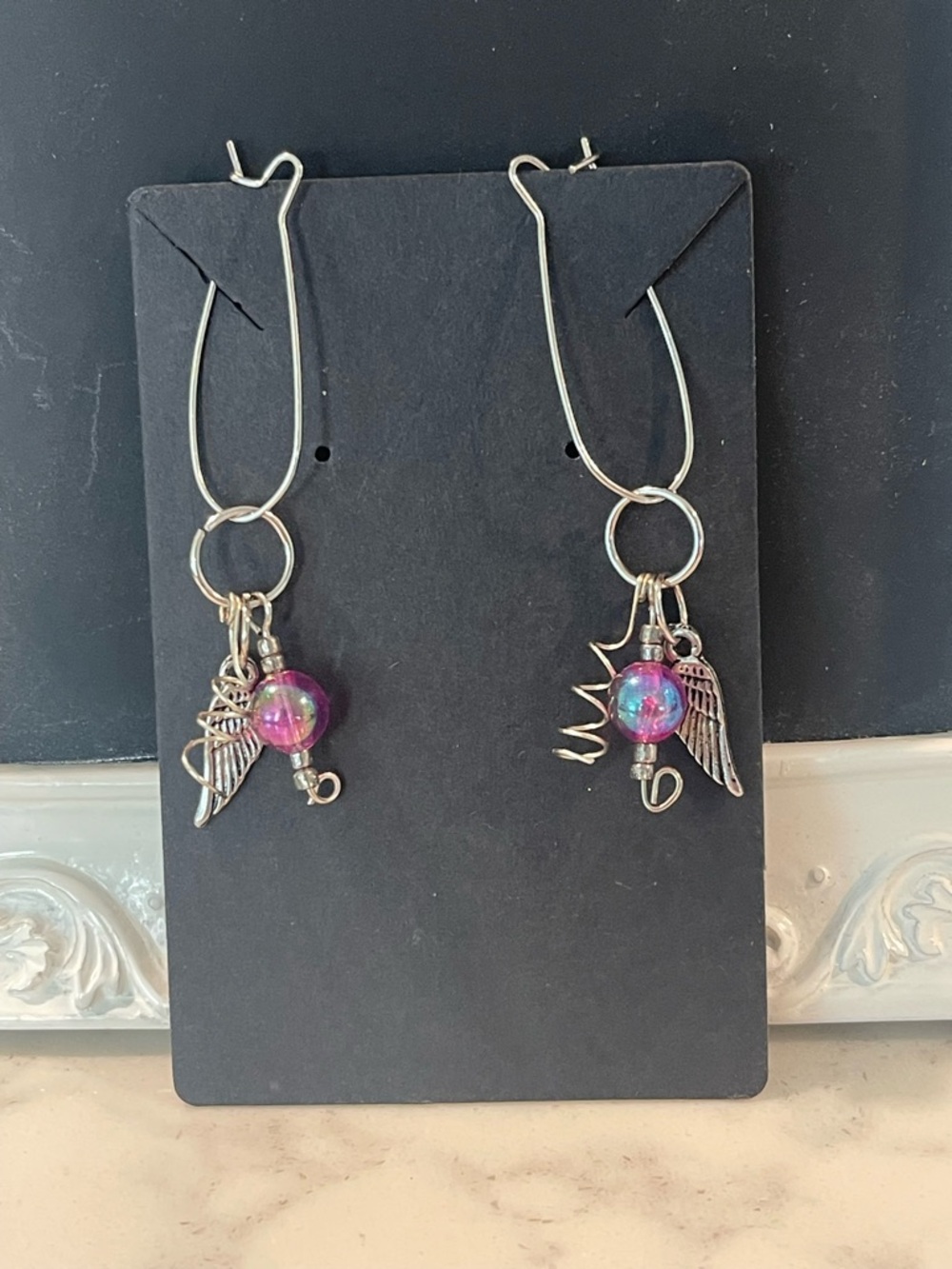 Women's Silver Hoop Earrings with Iridescent Pink-Blue Beads and Wing Charms